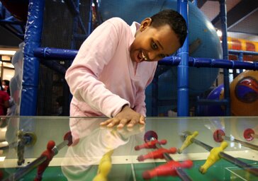 Mohamed Ali, 11 plays at a McDonald's indoor playground in Toronto. (Yvonne Berg for The Globe and Mail)