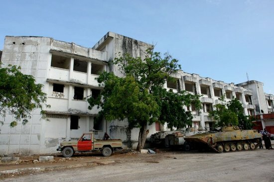 armoured-personal-carriers-are-parked-outside-the-ruined-villa-somalia