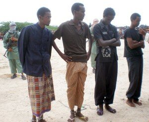 Four men sentenced to have a hand and foot cut off stand in a square in north of Mogadishu, Somalia, Monday June 22, 2009. (THE ASSOCIATED PRESS)