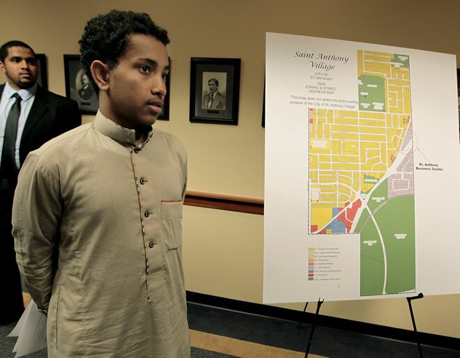 Abdullahi Mohamed, 15, stood next to one of the land renderings available after U.S. Attorney Andrew Luger announced the filing of a lawsuit against the city of St. Anthony.