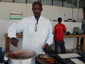 In this photo taken Wednesday, Aug, 28, 2013. Ahmed Jama a British Somali chef and one of last year’s TEDx Mogadishu speakers, cooking food at his hotel in Mogadishu, Somalia. Ahmed spoke last year and will speak again this year. He said last year’s talk "connected me to the world." The talk won him an invitation to a cooking event in Denmark. The short talks by artists and intellectuals at events known as TEDx have been held 7,500 times in more than 150 countries, but there may not be an event more challenging or dangerous as the TEDx talk being held in Mogadishu this Saturday. Then again, there may be no city in the world that needs its smartest and strongest voices heard as much as Somalia’s capital, which is clawing its way forward to move beyond its bombs-and-bullets past. FARAH ABDI WARSAMEH — AP Photo