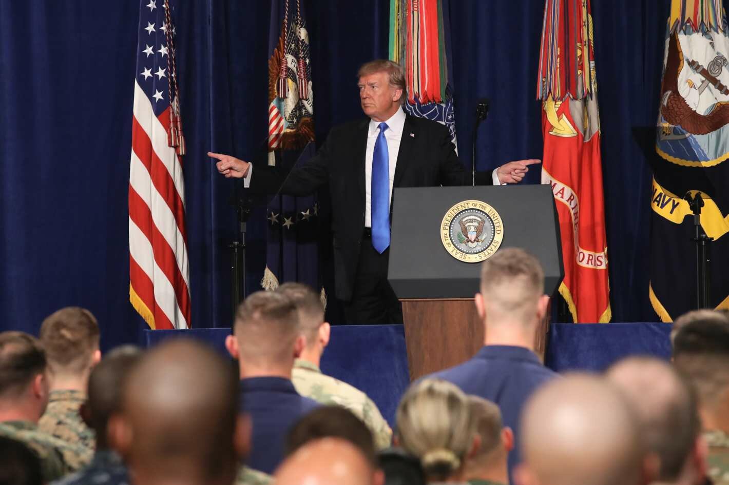 Donald Trump backs off Afghan withdrawal, warns Pakistan